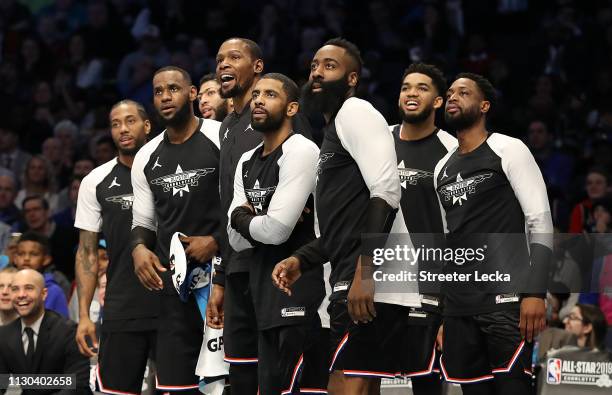 Members of Team LeBron watch play from the bench in the third quarter during the NBA All-Star game as part of the 2019 NBA All-Star Weekend at...