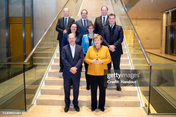 In this handout photo provided by the German Government Press Office , the Coalition Committee of the CDU, SPD and CSU in the German Bundestag pose...