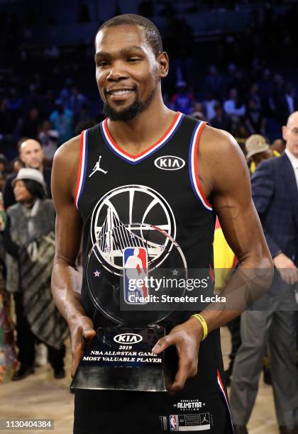 Kevin Durant of the Golden State Warriors and Team LeBron celebrates with the MVP trophy after their 178-164 win over Team Giannis during the NBA...