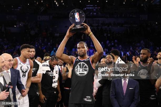Kevin Durant of the Golden State Warriors and Team LeBron celebrates with the MVP trophy after their 178-164 win over Team Giannis during the NBA...
