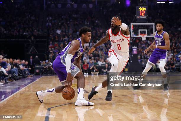 Buddy Hield of the Sacramento Kings drives tot the basket against James Ennis III at Golden 1 Center on February 6, 2019 in Sacramento, California....