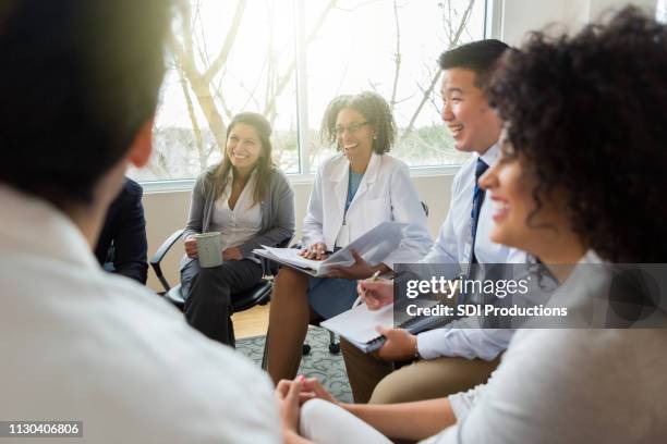 hospital management meets with healthcare professionals - leadership listening stock pictures, royalty-free photos & images