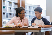Tutor working with middle school student