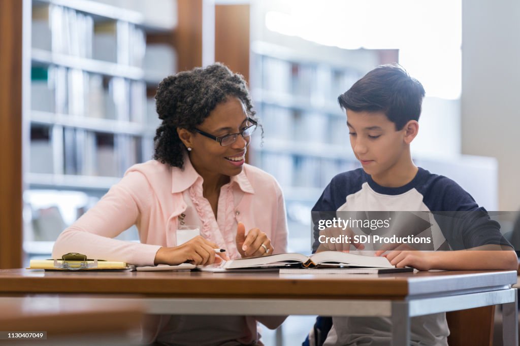 Tutor working with middle school student