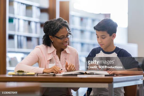 tutor working with middle school student - coach stock pictures, royalty-free photos & images