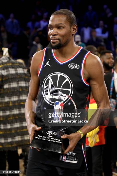 Kevin Durant of the Golden State Warriors and Team LeBron celebrates with the MVP trophy after their 178-164 win over Team Giannis during the NBA...