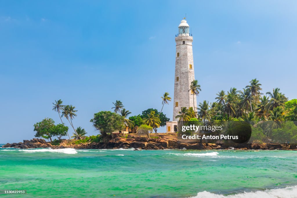 White lighthouse Dondra Head and tropical palms, Sri Lanka