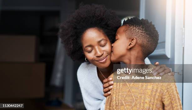 it's the little gestures that mean a lot - mother cheek stock pictures, royalty-free photos & images