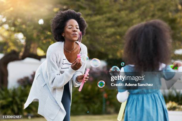 even mom feels like a kid again - bubble wand stock pictures, royalty-free photos & images