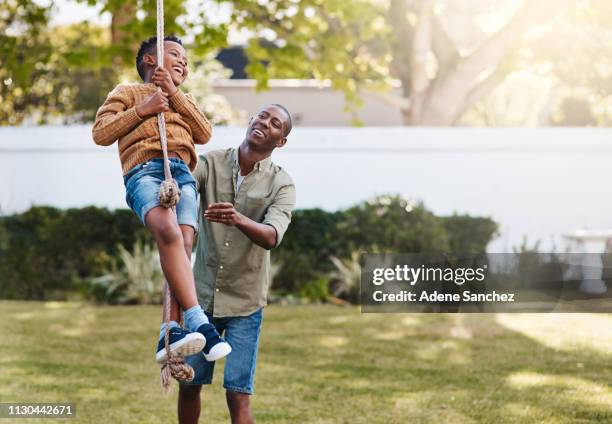 outdoor play is essential in a child's development - swing play equipment stock pictures, royalty-free photos & images