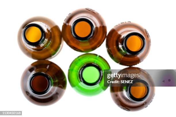 brown and green bottles seen from above - beer bottle stock-fotos und bilder