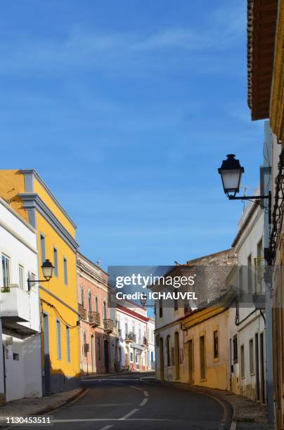 street of paderne portugal - couleur vive stock-fotos und bilder