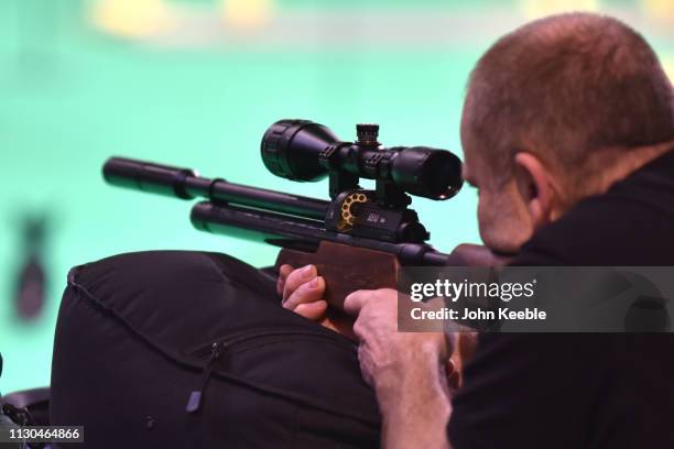 Visitor fires a rifle at a pratice range at the Great British Shooting Show at NEC Arena on February 15, 2019 in Birmingham, England. The show is the...