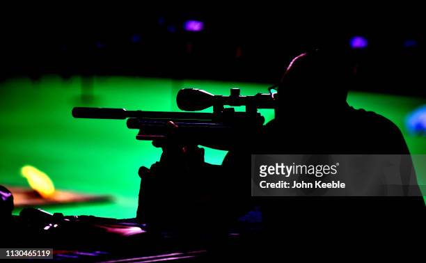Silhouette of a visitor firing a rifle at a pratice range at the Great British Shooting Show at NEC Arena on February 15, 2019 in Birmingham,...