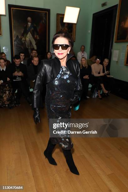 Dame Joan Collins attends the Erdem show during London Fashion Week February 2019 at the National Portrait Gallery on February 18, 2019 in London,...