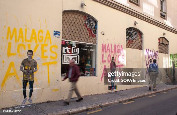 Murals with graffiti of Spanish actor Antonio Banderas, actress and singer Marisol, actor Dani Rovira and humorist 'Chiquito de la Calzada' are seen...