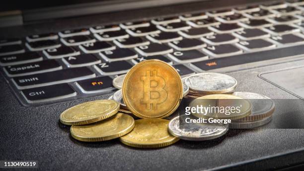 bitcoin and laptop - bitcoin stock pictures, royalty-free photos & images