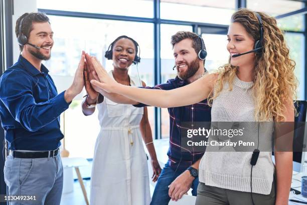 successful teams put positivity into practice - call center team stock pictures, royalty-free photos & images