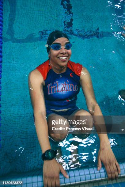 Female Swimmer Smiling In Indoor Pool