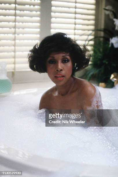 American actress singer, film and television star Diahann Carroll soaks in hot tub on the set of television hit series Dynasty in Hollywood...