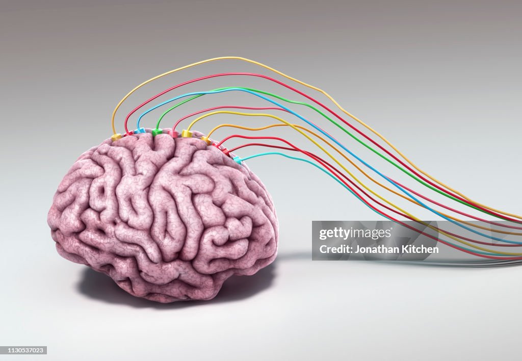 A pink brain with wiring connected to the brain