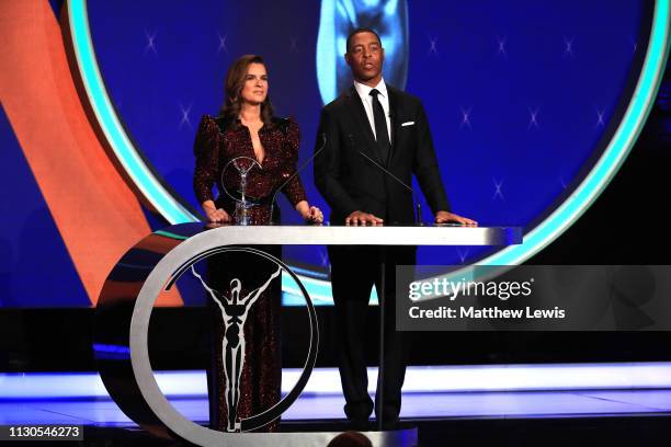 Laureus Academy Member Katarina Witt announces the Laureus World Comeback Of The Year 2019 winner Tiger Woods on stage with Laureus Academy Member...