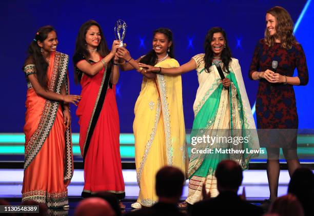 Neeta Kumari, Hema Kumari, Konika Kumari, Radha Kumari, and Franz Gastler and Rose Gastler of the Yuwa Football Girls team, a football-based charity...