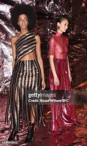 Models pose at the Paula Knorr presentation during London Fashion