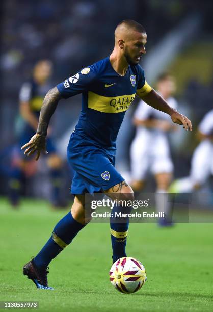Dario Benedetto of Boca Juniors drives the ball during a match between Boca Juniors and Lanus as part of Superliga 2018/19 at Estadio Alberto J....