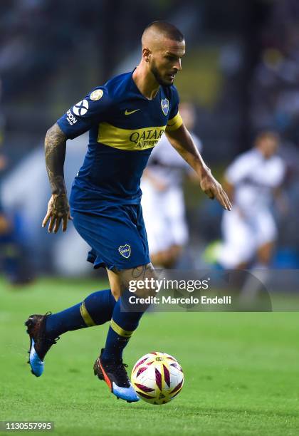 Dario Benedetto of Boca Juniors drives the ball during a match between Boca Juniors and Lanus as part of Superliga 2018/19 at Estadio Alberto J....