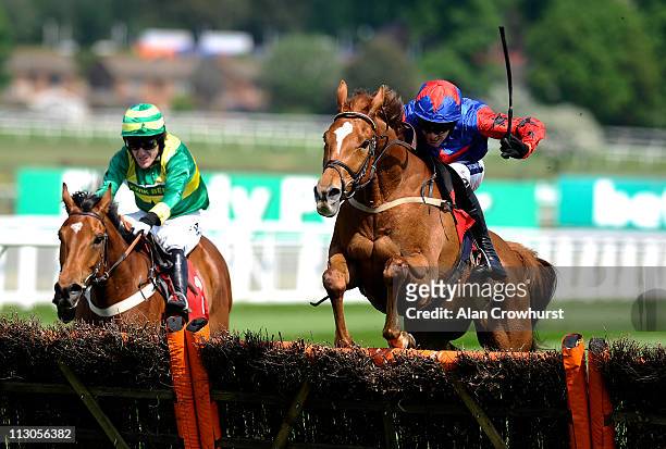 Aidan Coleman riding The Jigsaw Man clear the last to win The bet365.com Hurdle Race from Clerk's Choice at Sandown racecourse on April 23, 2011 in...