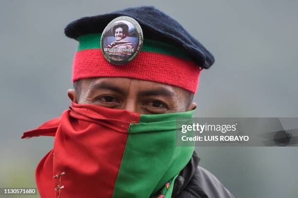 An indigenous man poses for a picture n the Pan-American highway during a protest to demand the government the fulfillment of several agreements on...