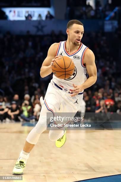 Stephen Curry of the Golden State Warriors and Team Giannis drives against Team LeBron in the third quarter during the NBA All-Star game as part of...