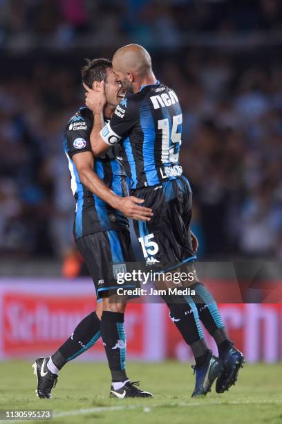 Lisandro Lopez celebrates after scoring the first goal of his team with teammate Dario Cvitanich during a match between Racing Club and Godoy Cruz as...