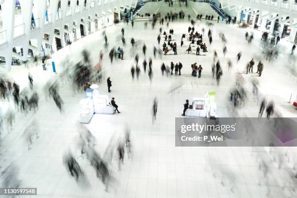 the oculus: people moving - world trade center interior stock pictures, royalty-free photos & images