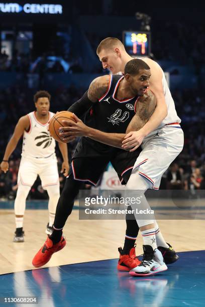 LaMarcus Aldridge of the San Antonio Spurs and Team LeBron looks to drive against Nikola Jokic of the Denver Nuggets and Team Giannis in the third...