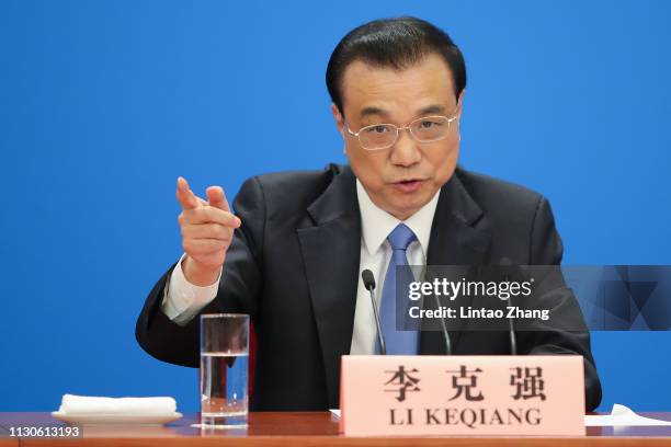 China's Premier Li Keqiang speaks during a news conference following the closing of the second session of the 13th National People's Congress at the...