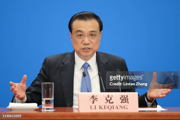 China's Premier Li Keqiang speaks during a news conference following the closing of the second session of the 13th National People's Congress at the...