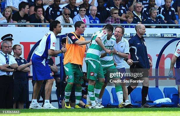 Player Adel Taarabt celebrates his second QPR goal with manager v during the npower Championship game between Cardiff City and Queens Park Rangers at...