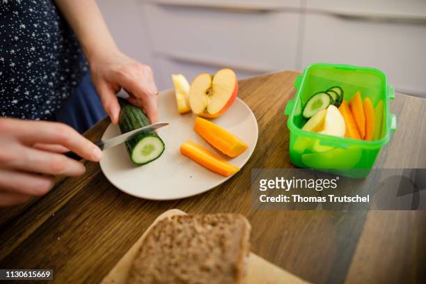 Berlin, Germany Symbolic photo on the theme of Healthy Eating for Children. A bread box is filled with bread, fruit and vegetables for a kindergarten...