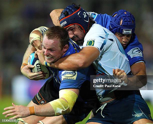 Richard Brown of the Force pushes to the try line while being tackled by Victor Matfield of the Bulls during the round 10 Super Rugby match between...