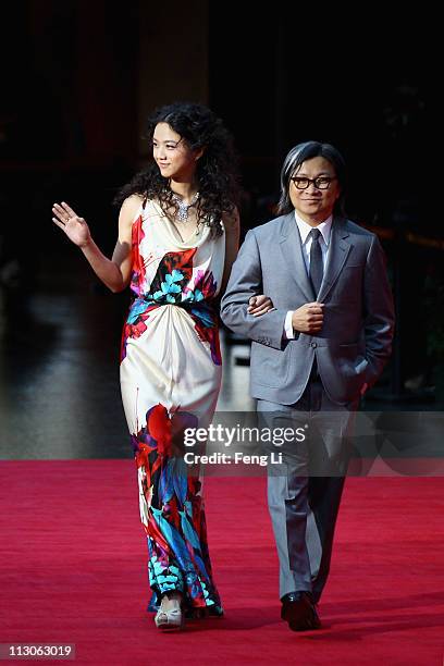 Actress Tang Wei and director Peter Chan arrive at the red carpet of the first Beijing International Film Festival at China's National Grand Theater...