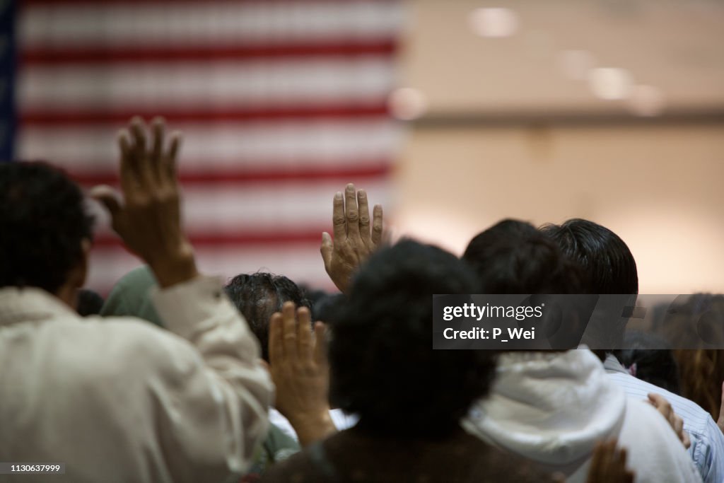 Immigrants at a swearing in ceremony