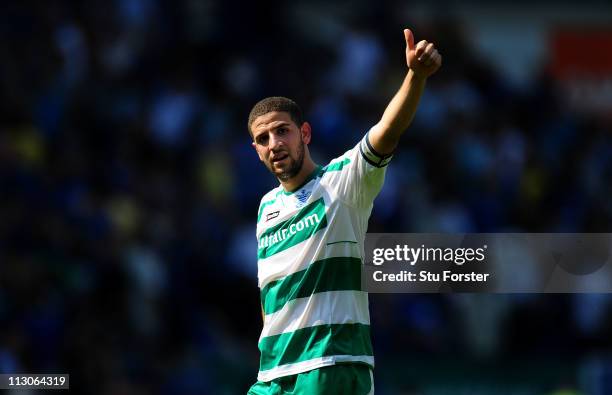 Player Adel Taarabt acknowledges the fans at the end of the npower Championship game between Cardiff City and Queens Park Rangers at Cardiff City...