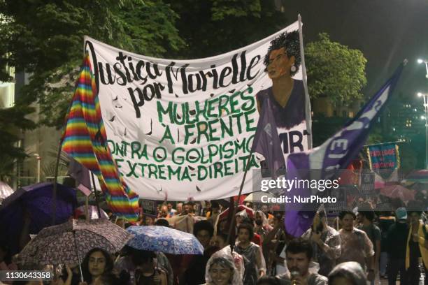 People attend a memorial Mass to mark the one-year death anniversary of slain councilwoman Marielle Franco, at the Candelaria Catholic Church in Rio...