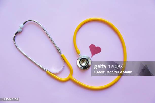 stethoscope - stethoscope heart stock-fotos und bilder