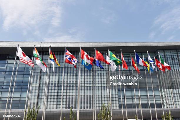 beijing, china, national convention center,  flags, - national center for culture stock pictures, royalty-free photos & images