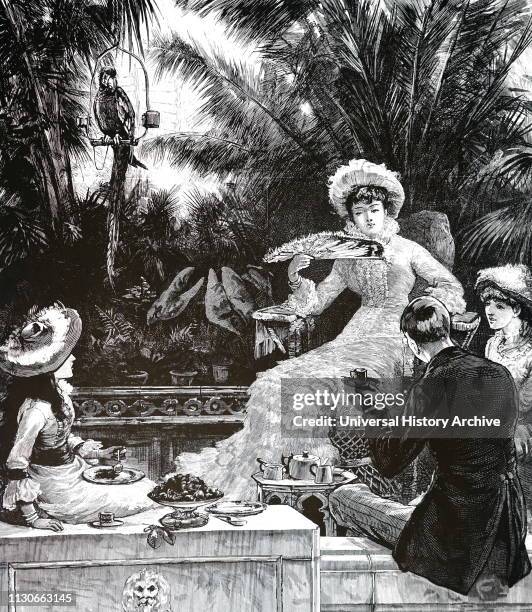 Illustration showing, wealthy people having afternoon tea, inside a lushly planted, glass and steel conservatory; England, 1893.