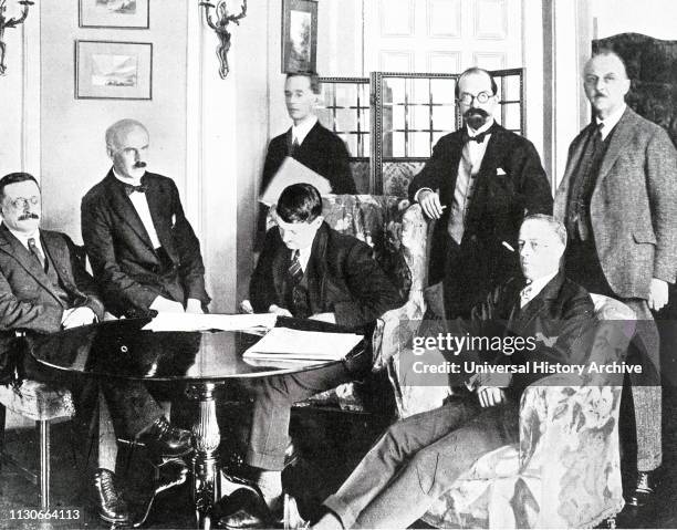 Photograph showing the signing of the Anglo-Irish Treaty, an agreement between the government of the United Kingdom of Great Britain and Ireland and...