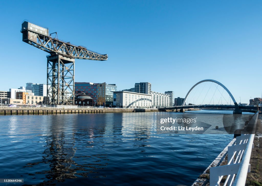The River Clyde in central Glasgow, with the Finnieston Crane, the Rotunda, the Radisson Hotel, the Hilton Garden Inn and Glasgow Arc ("Squinty Bridge"..